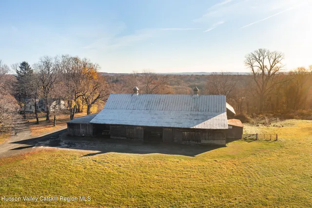 a kitchen with stainless steel appliances granite countertop a refrigerator and a stove