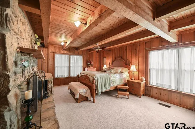 a bed room with a bed and a fireplace