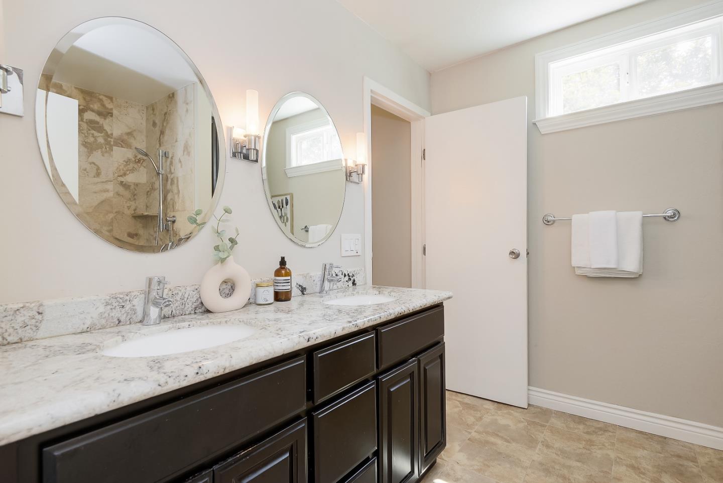 1101 Reed Avenue, Unit B Sunnyvale, CA 94086 - Photo 14 of 19 a bathroom with a granite countertop double vanity sinks and a mirror