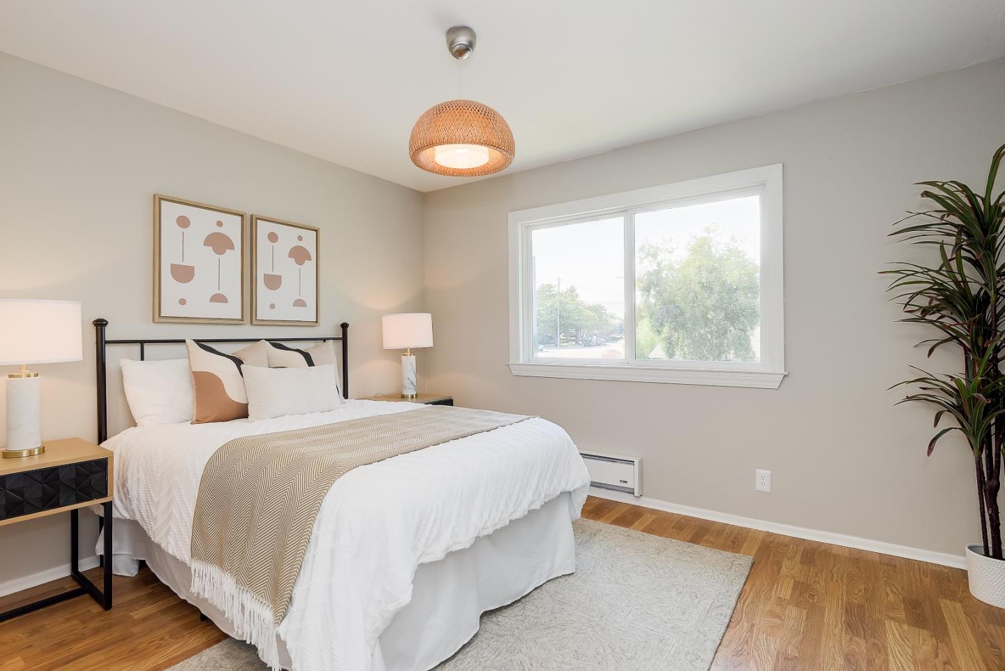 1101 Reed Avenue, Unit B Sunnyvale, CA 94086 - Photo 17 of 19 a bedroom with a large bed and a potted plant