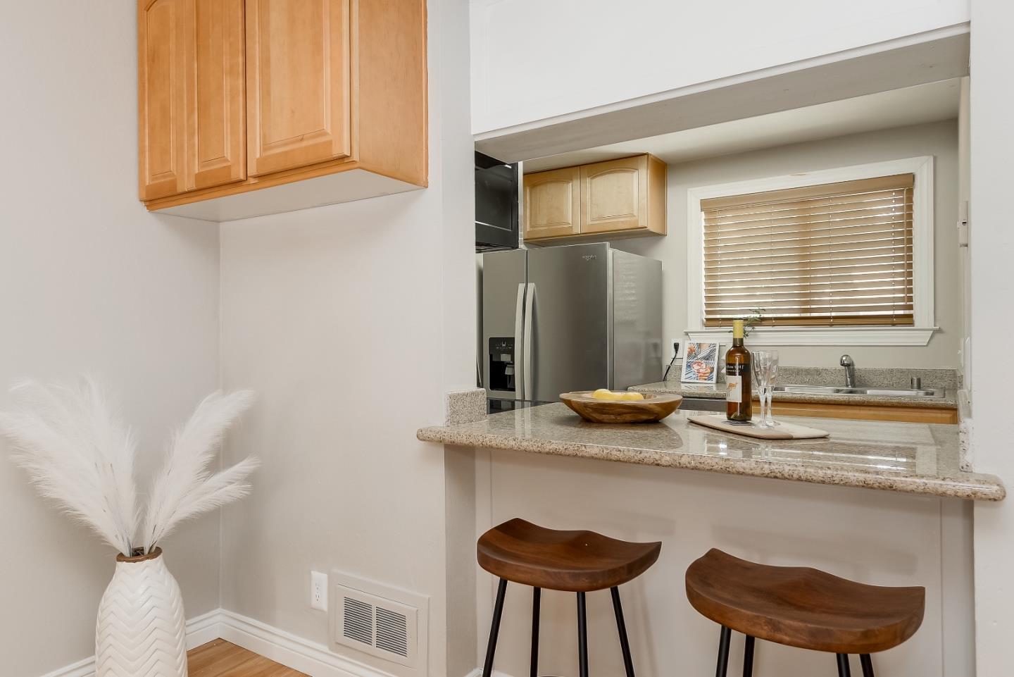 1101 Reed Avenue, Unit B Sunnyvale, CA 94086 - Photo 6 of 19 a kitchen with stainless steel appliances granite countertop a sink and a white wooden cabinets