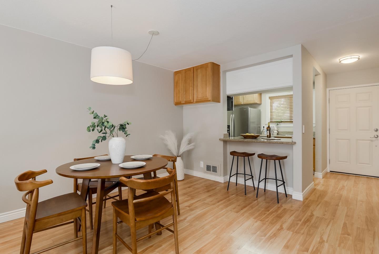 1101 Reed Avenue, Unit B Sunnyvale, CA 94086 - Photo 7 of 19 a view of a dining room with furniture and wooden floor