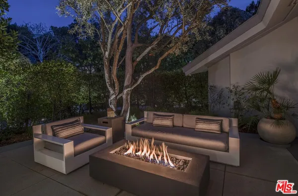 a view of a house with a garage and outdoor space