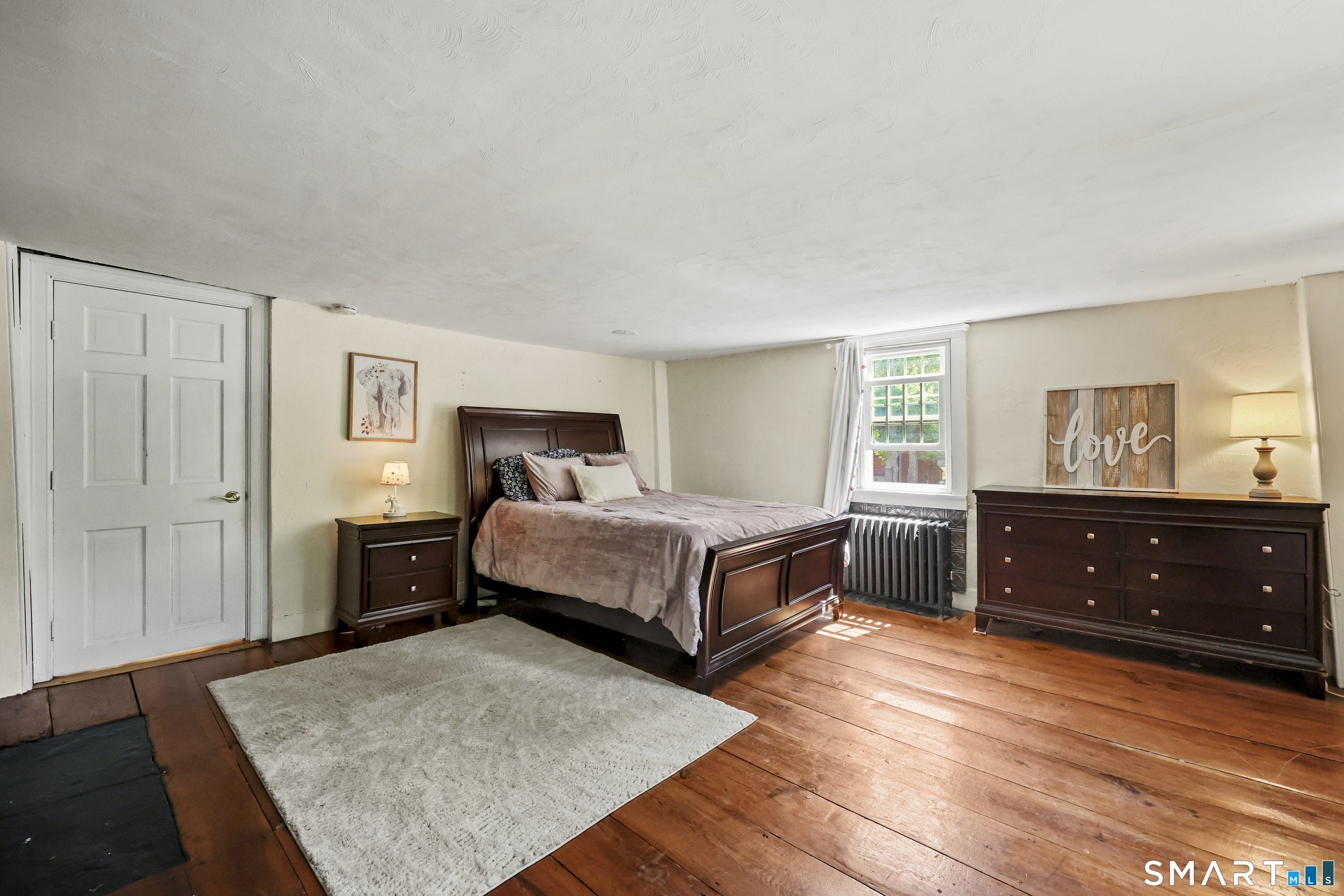 2880 Main Street Coventry, CT 06238 - Photo 24 of 40 3 total upper level bedrooms all with wide plank floors, fireplaces, & custom built-ins.