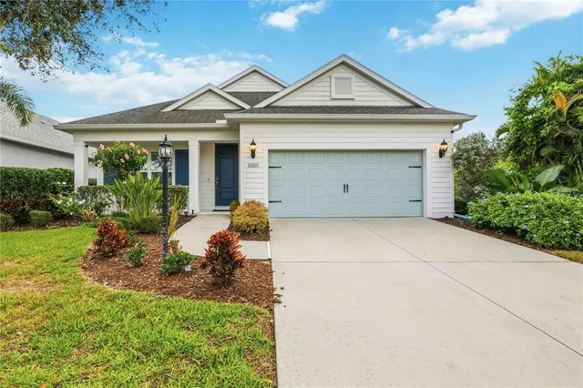 a view of a house with a yard and plants