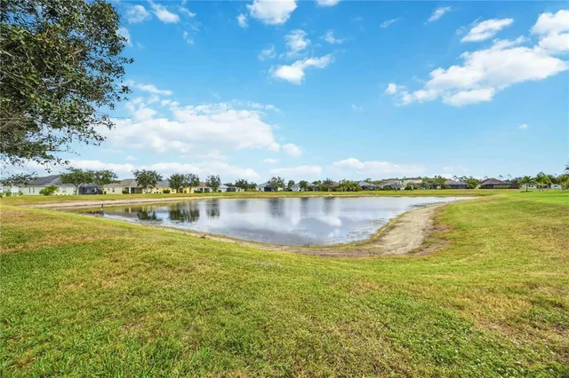 a view of house with outdoor space and swimming pool