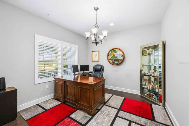 a kitchen with a stove a table and chairs in it