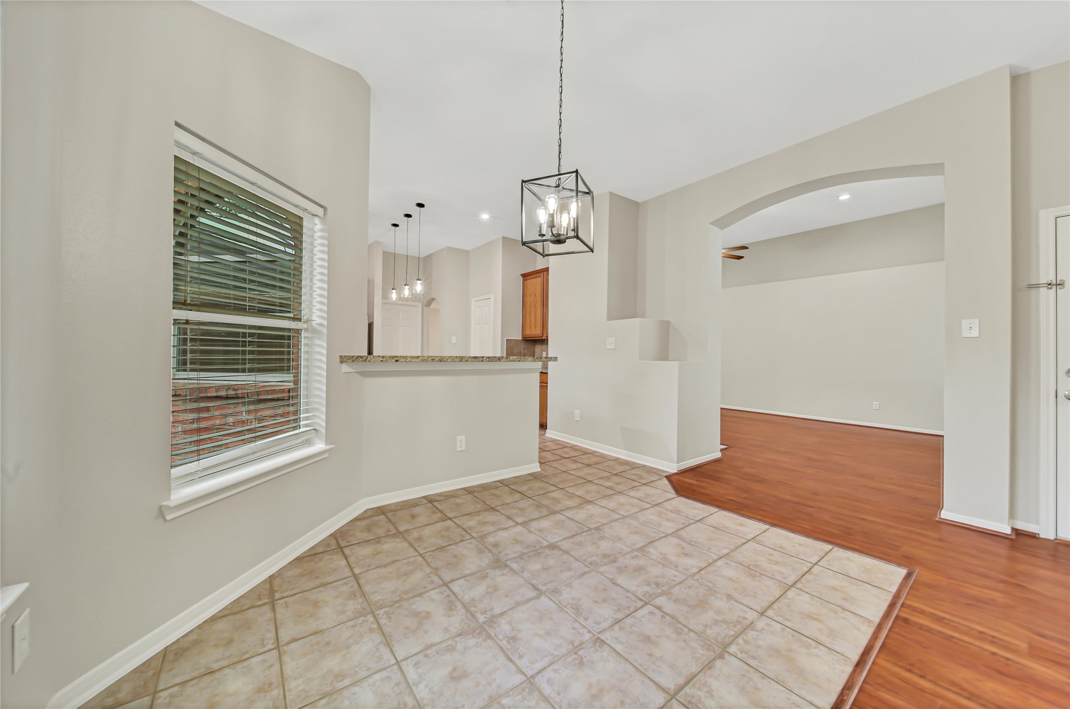 14526 Red Tailed Hawk Lane Houston, TX 77044 - Photo 15 of 40 a view of empty room with wooden floor and window