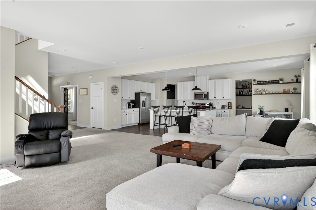 1618 Almer Lane Chester, VA 23836 - Photo 16 of 59 a living room with furniture and a couch
