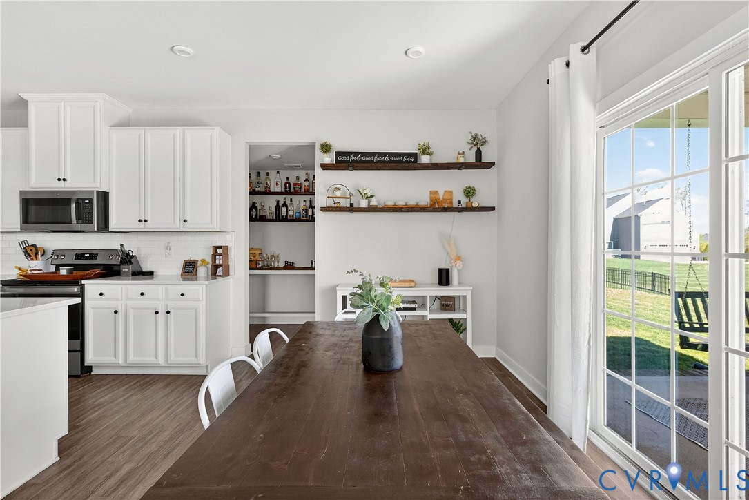 1618 Almer Lane Chester, VA 23836 - Photo 20 of 59 a kitchen with refrigerator and cabinets