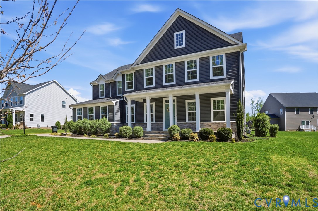1618 Almer Lane Chester, VA 23836 - Photo 2 of 59 a front view of a house with garden and trees