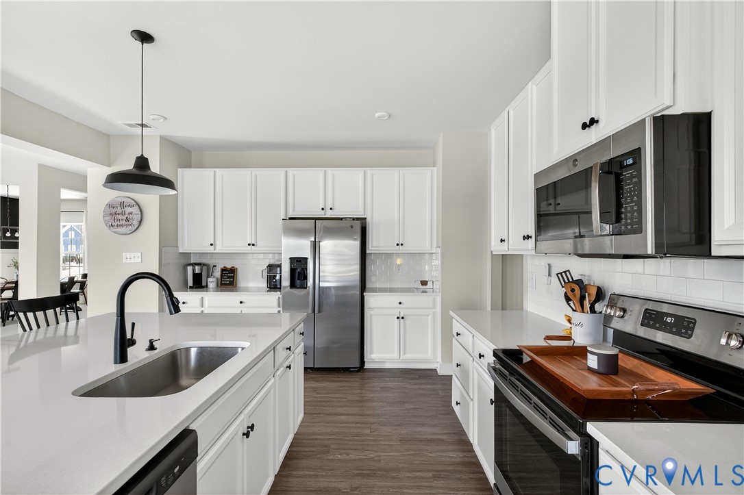 1618 Almer Lane Chester, VA 23836 - Photo 22 of 59 a kitchen with stainless steel appliances a sink stove and refrigerator