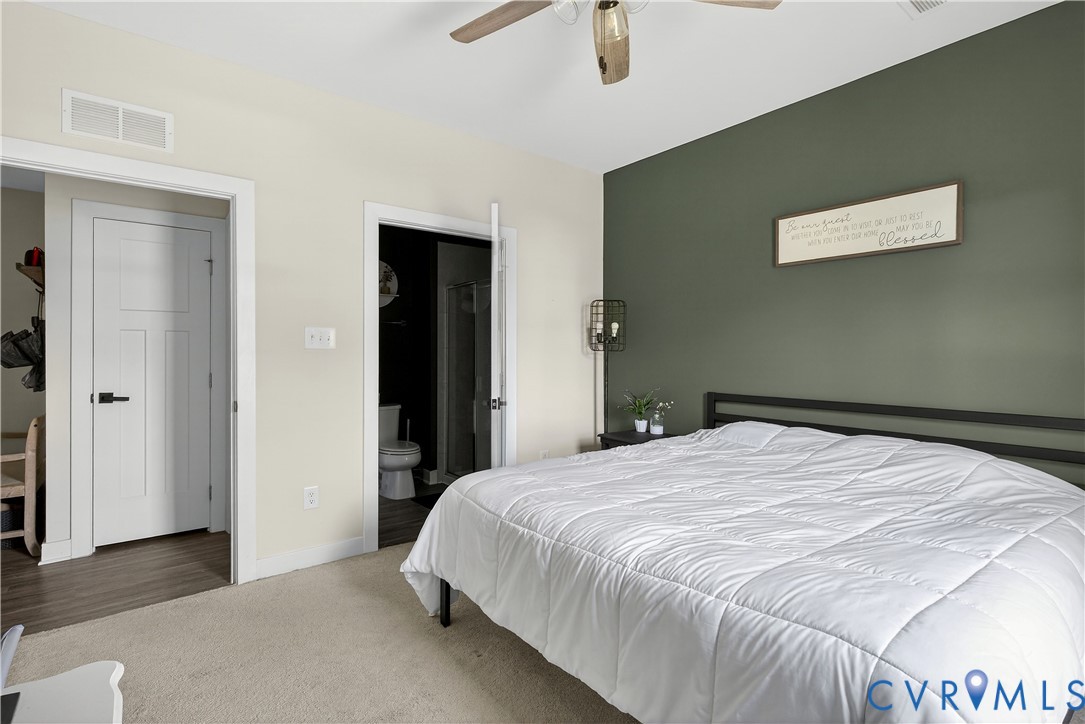 1618 Almer Lane Chester, VA 23836 - Photo 27 of 59 a bedroom with a bed and a painting on the wall