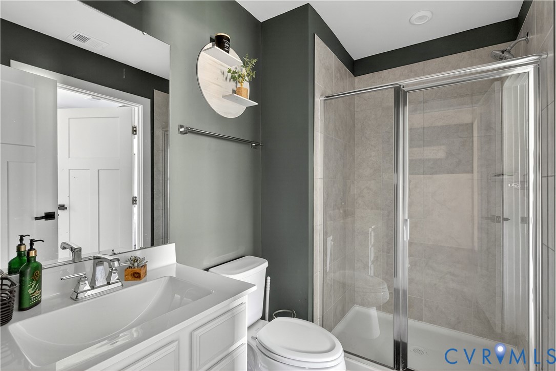 1618 Almer Lane Chester, VA 23836 - Photo 28 of 59 a bathroom with a sink a toilet and shower