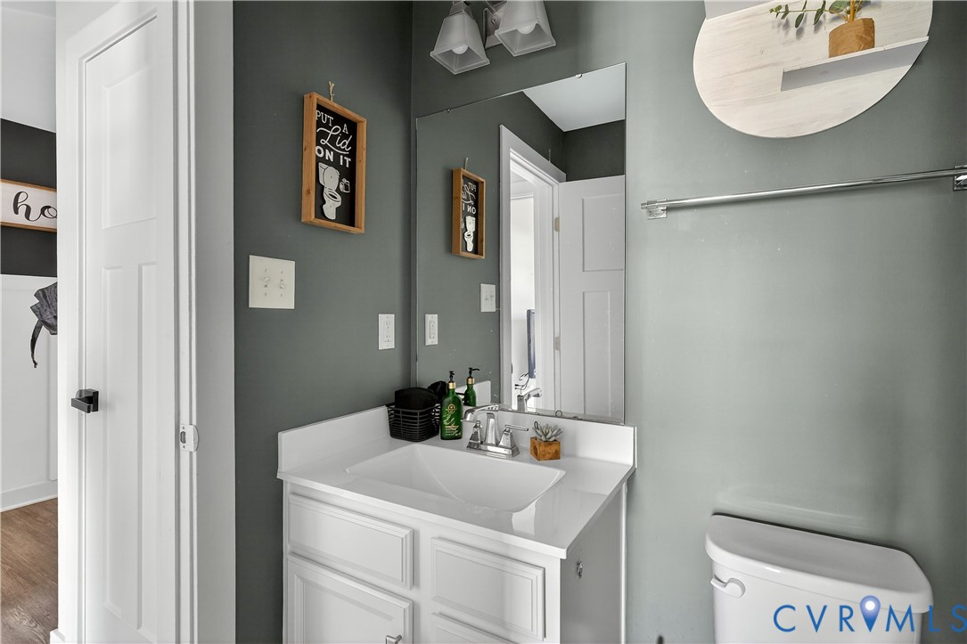 1618 Almer Lane Chester, VA 23836 - Photo 29 of 59 a bathroom with a sink and a mirror