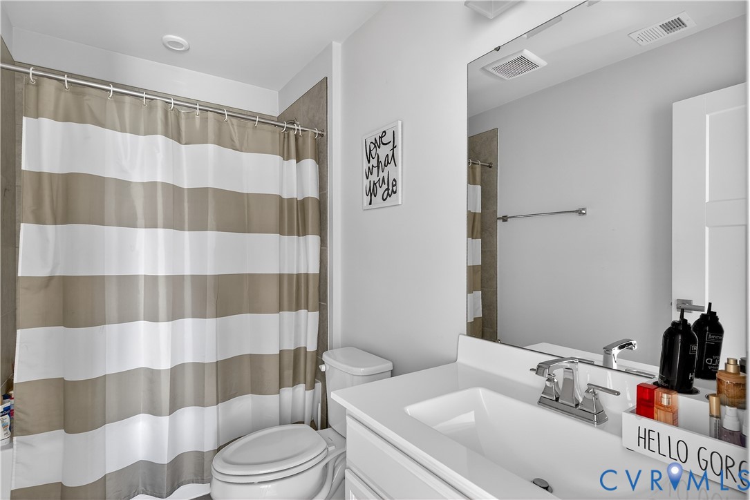 1618 Almer Lane Chester, VA 23836 - Photo 31 of 59 a bathroom with a sink a toilet a shower and a mirror