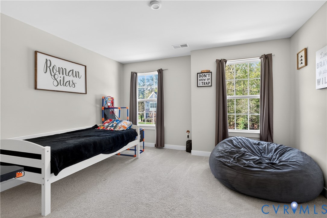 1618 Almer Lane Chester, VA 23836 - Photo 35 of 59 a bedroom with a bed and a window