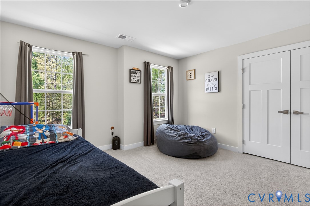1618 Almer Lane Chester, VA 23836 - Photo 36 of 59 a bedroom with a bed and a window