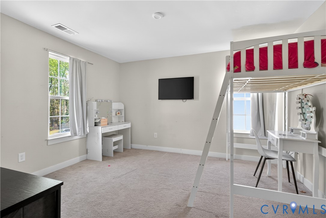 1618 Almer Lane Chester, VA 23836 - Photo 37 of 59 a living room with furniture and a flat screen tv