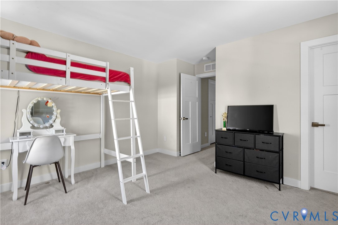 1618 Almer Lane Chester, VA 23836 - Photo 38 of 59 a bedroom with a bed and a chair