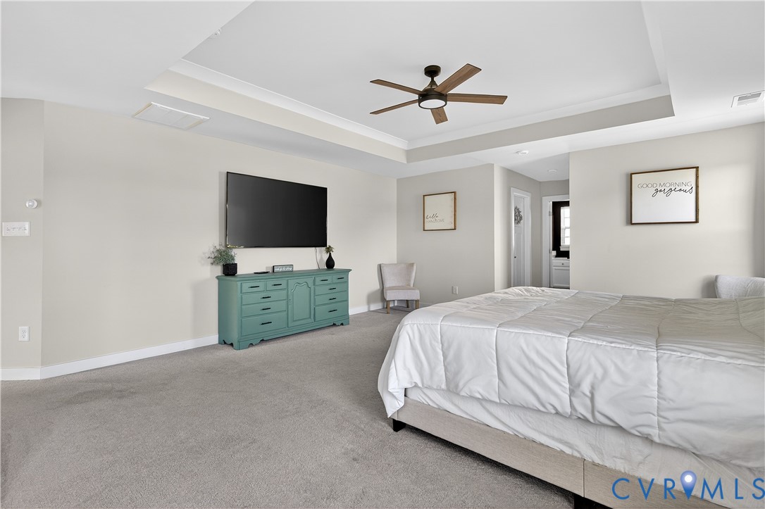1618 Almer Lane Chester, VA 23836 - Photo 40 of 59 a spacious bedroom with a bed and a flat screen tv