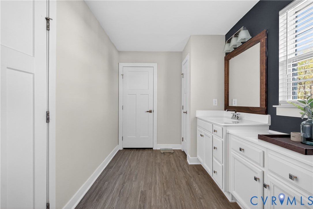 1618 Almer Lane Chester, VA 23836 - Photo 47 of 59 a bathroom with a sink and a mirror