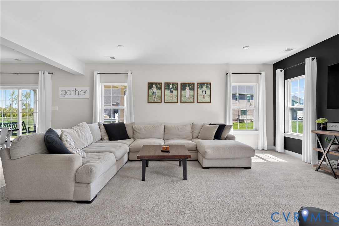 1618 Almer Lane Chester, VA 23836 - Photo 48 of 59 a living room with furniture and a flat screen tv