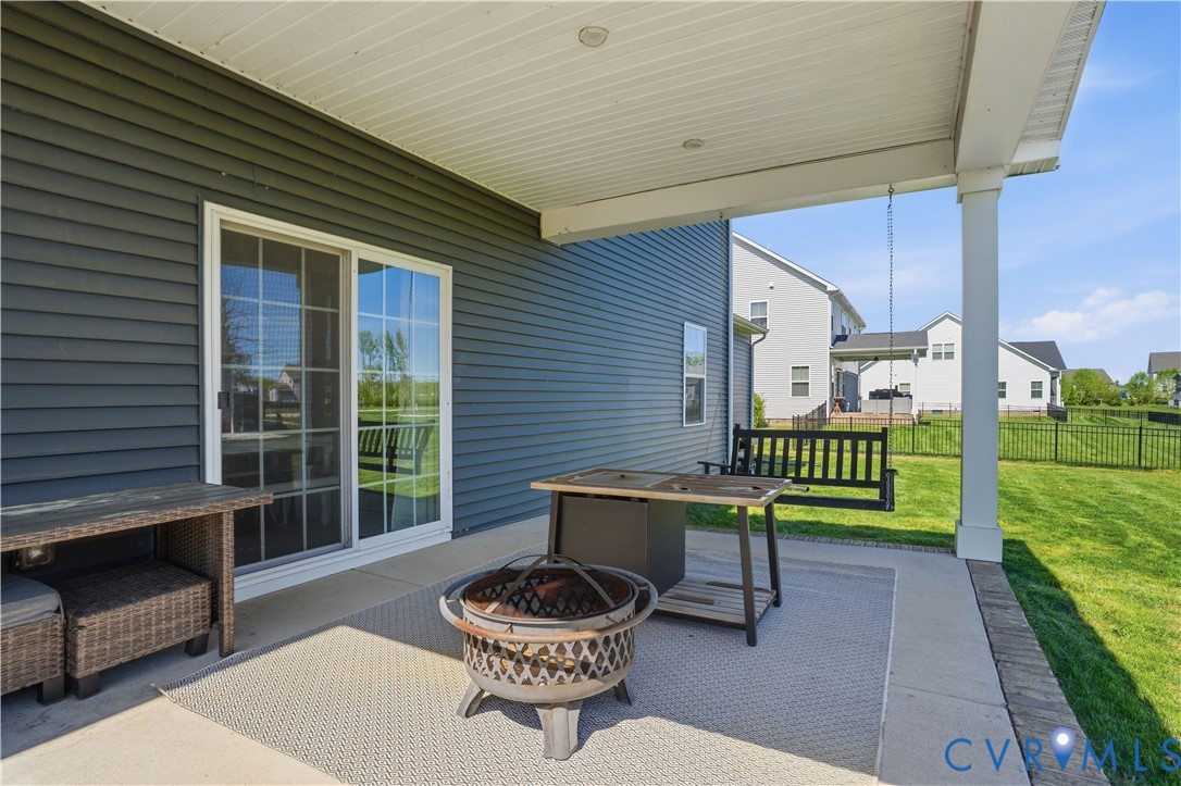 1618 Almer Lane Chester, VA 23836 - Photo 54 of 59 a balcony with chairs and a swing chair