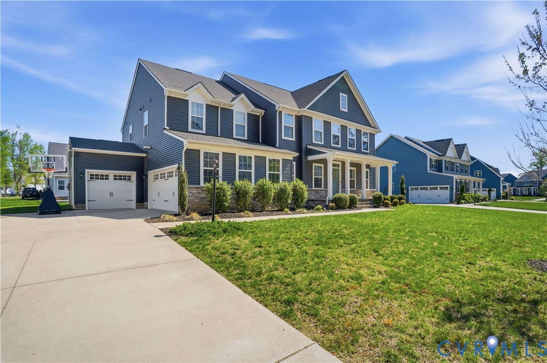 1618 Almer Lane Chester, VA 23836 - Photo 58 of 59 a front view of a house with a garden and plants