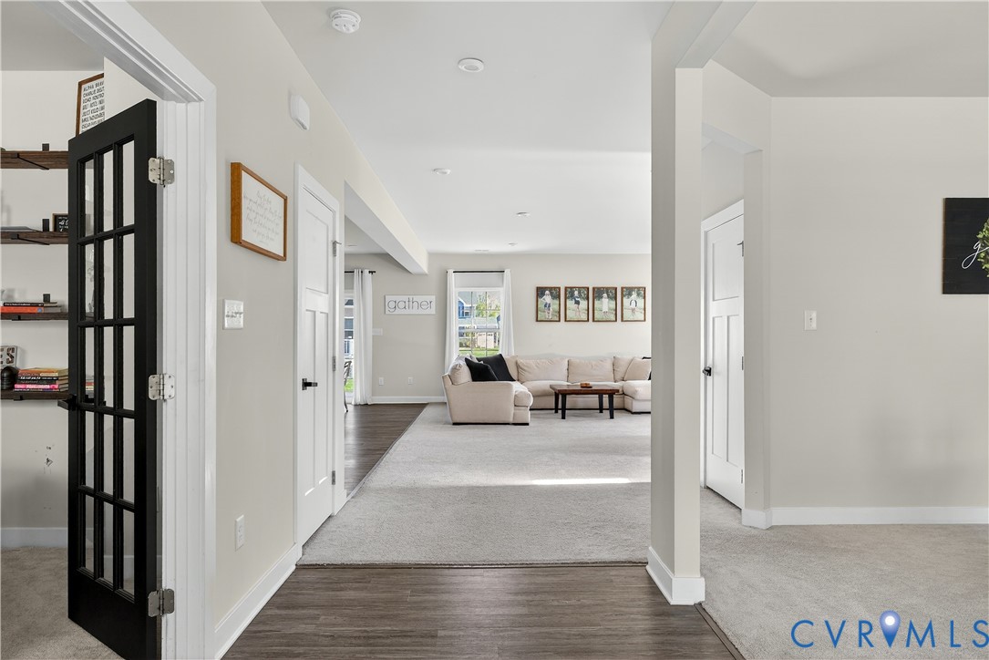 1618 Almer Lane Chester, VA 23836 - Photo 6 of 59 a view of a hallway with wooden floor and dining room