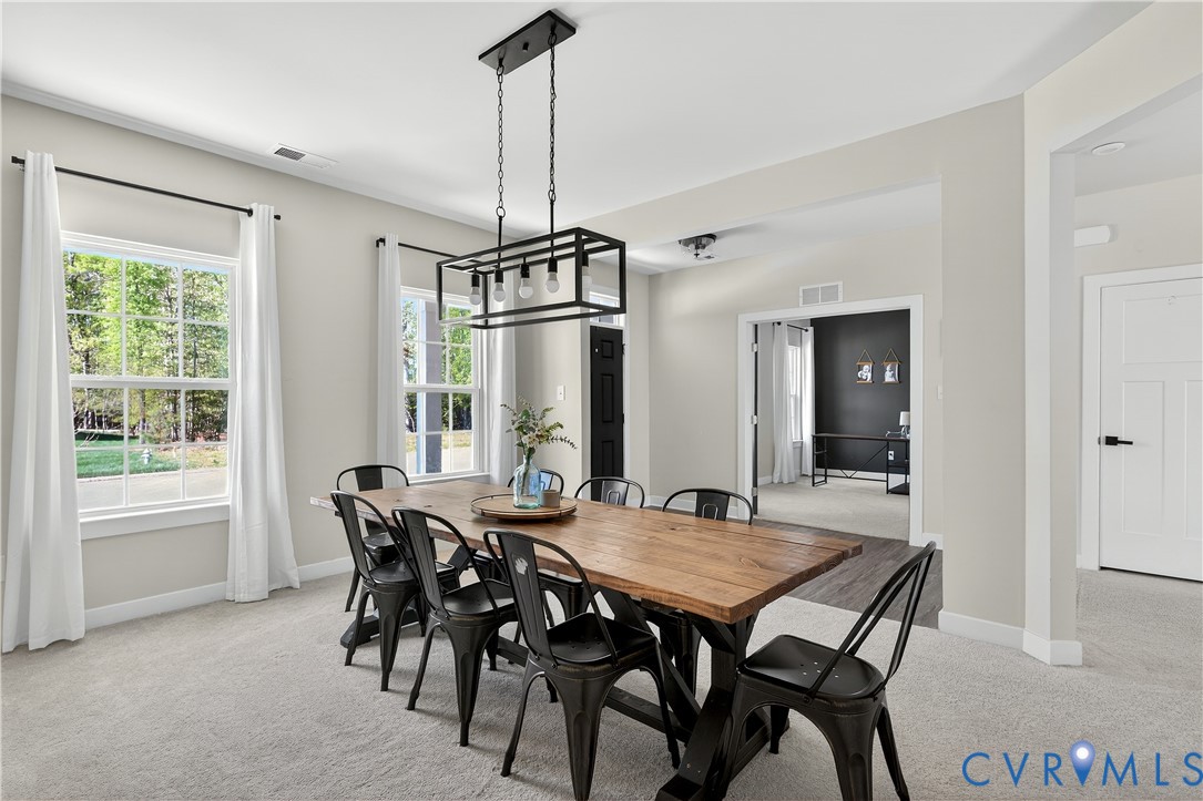 1618 Almer Lane Chester, VA 23836 - Photo 10 of 59 a view of a dining room with furniture window and outside view