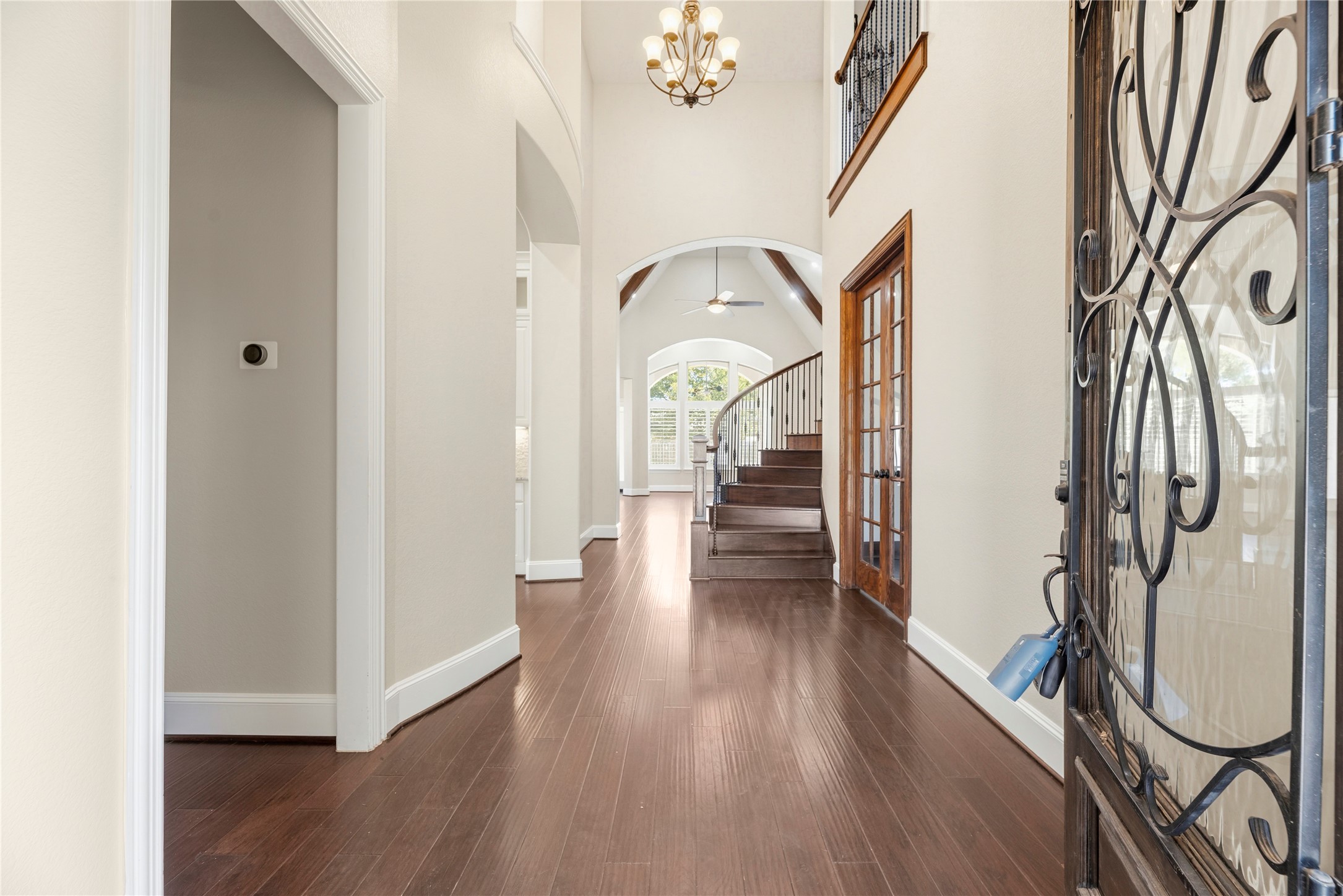 28226 South Firethorne Road Katy, TX 77494 - Photo 5 of 39 The grand entrance makes a sophisticated first impression with soaring ceilings, a designer chandelier, and an elegant curved staircase with wrought iron spindles.