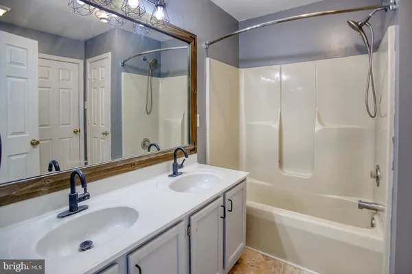a bathroom with a sink and a tub