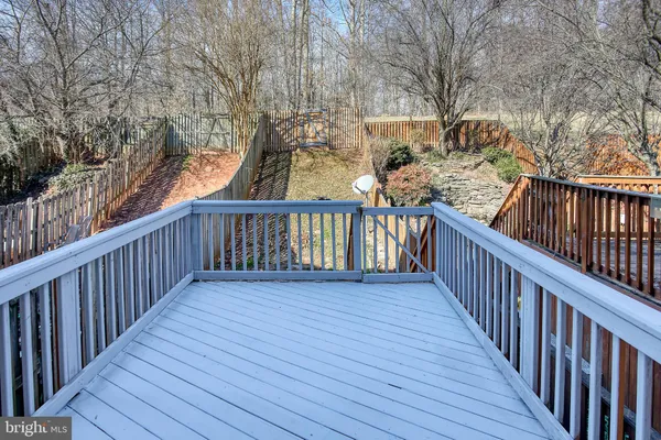 a view of a balcony with wooden floor