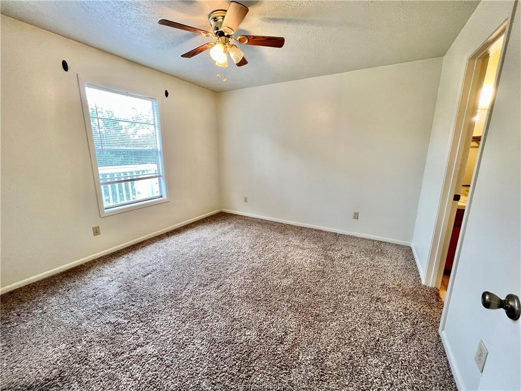711 Vassar Court, Unit B College Station, TX 77840 - Photo 11 of 23 a view of an empty room with a window