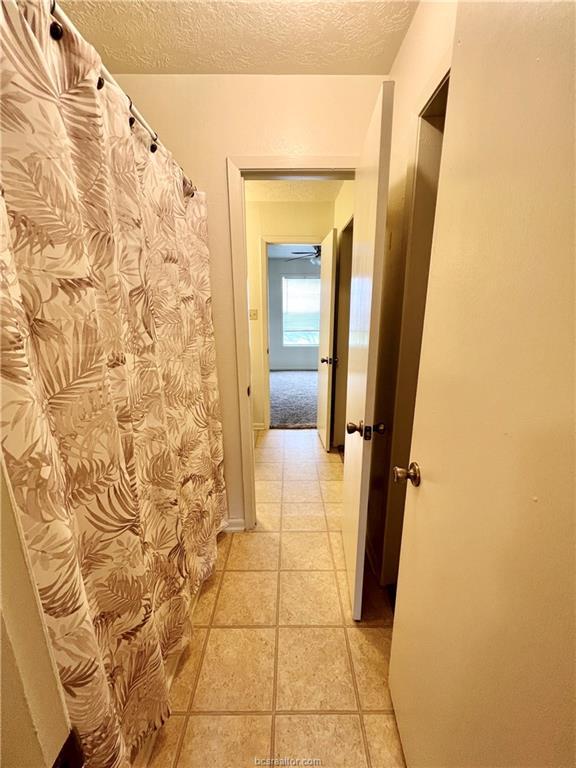 711 Vassar Court, Unit B College Station, TX 77840 - Photo 15 of 23 a bathroom with a shower and a mirror