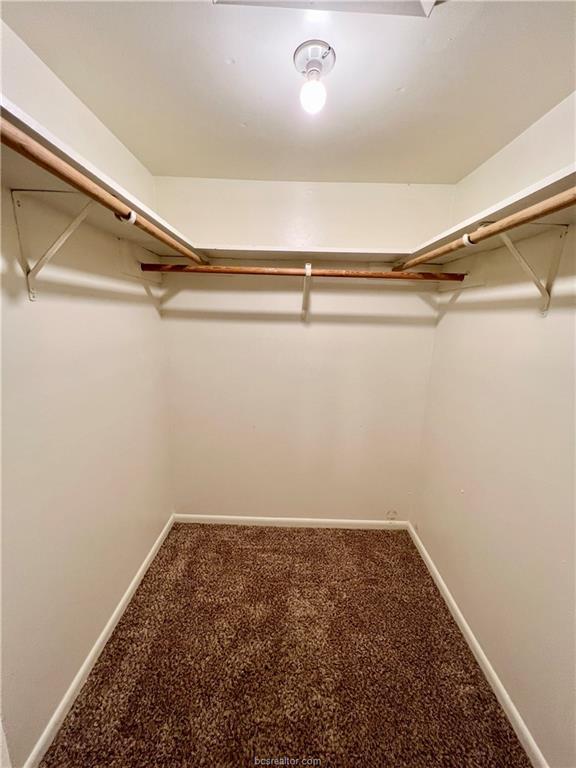 711 Vassar Court, Unit B College Station, TX 77840 - Photo 17 of 23 a view of a room with racks on the wall