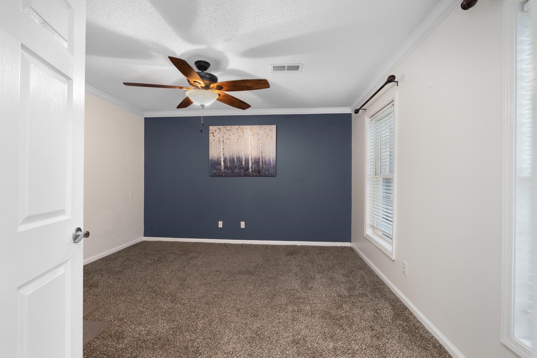 6525 North Watkins Road Millington, TN 38053 - Photo 24 of 35 an empty room with windows and fan