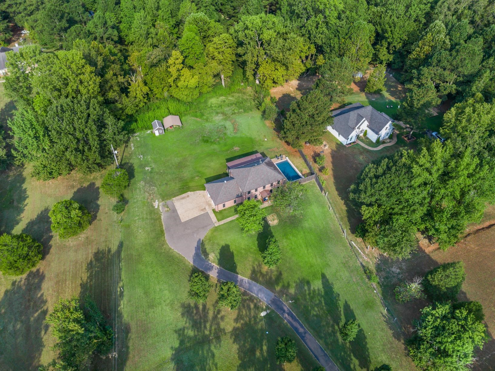 6525 North Watkins Road Millington, TN 38053 - Photo 34 of 35 an aerial view of residential house with outdoor space and trees all around