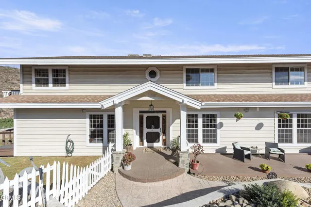 a front view of a house with glass windows