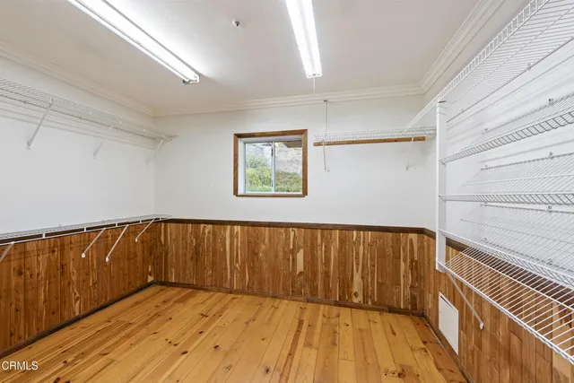 a view of wooden floor with a window
