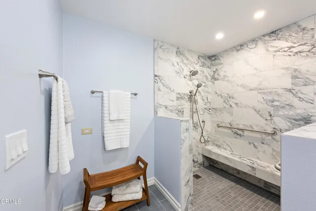 a bathroom with a tub sink and a shower