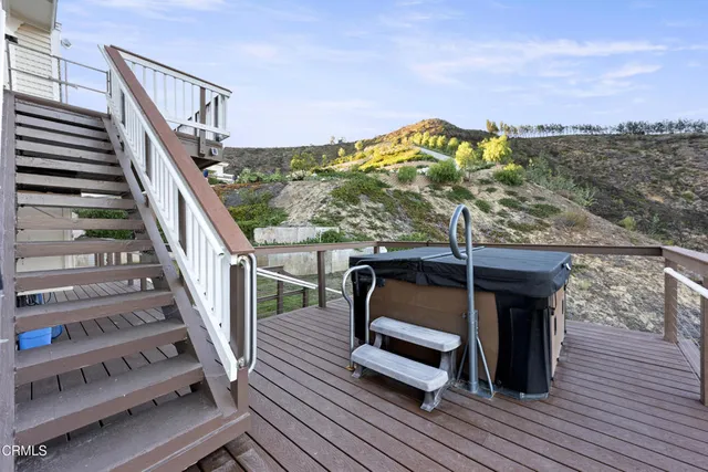 a view of a balcony with chairs