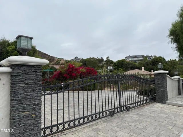 a balcony view with two chairs