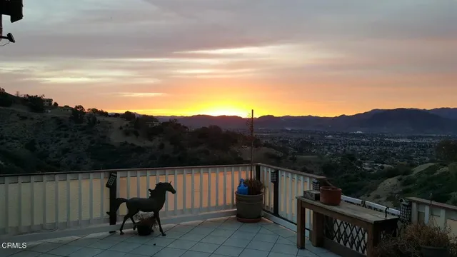 a view of a chairs and table in the roof
