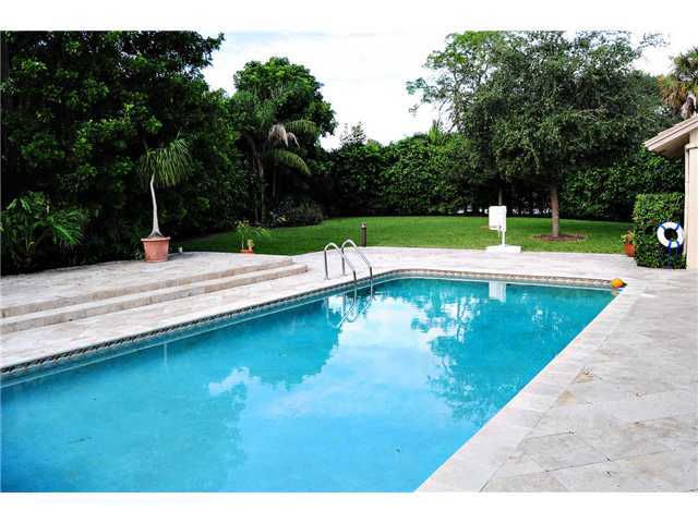 20989 Solano Way Boca Raton, FL 33433 - Photo 1 of 17 a view of a swimming pool with a patio