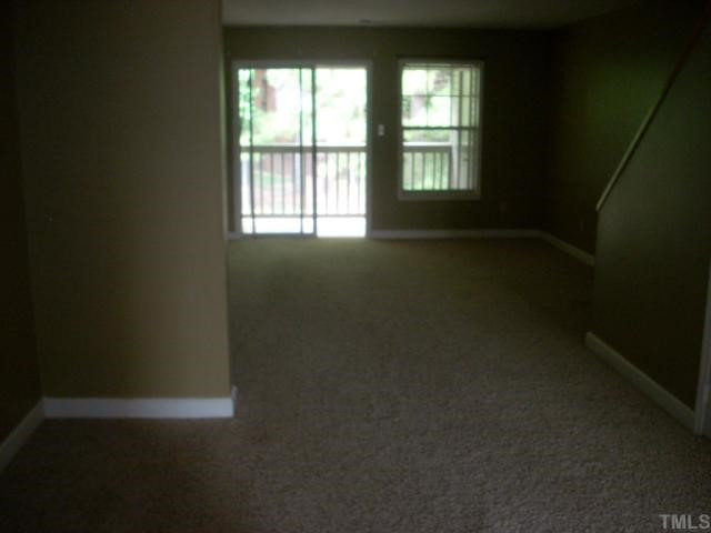 2510 Avent Ferry Road, Unit 202 Raleigh, NC 27606 - Photo 6 of 8 view of living room and balcony from dining room area Living Room