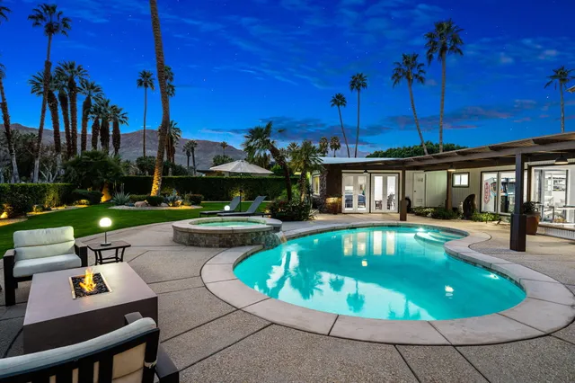 a view of a house with potted plants