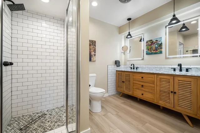 a view of a patio with couches table and chairs with garden view