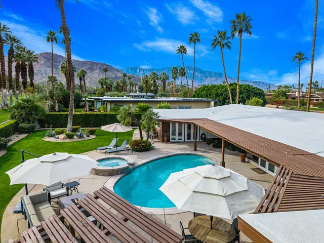 a view of a city with mountains in the background